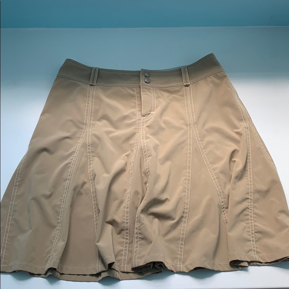 Tan Athleta skort with white stitching